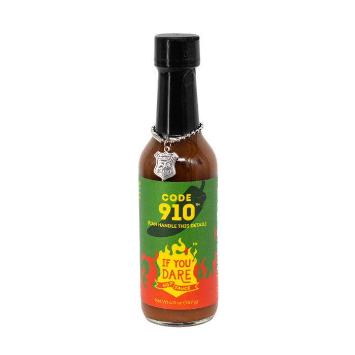 A bottle of Code 910 hot sauce with a label that includes a chili pepper and the text 'If You Dare Foods'.