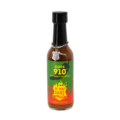 A bottle of Code 910 hot sauce with a label that includes a chili pepper and the text 'If You Dare Foods'.