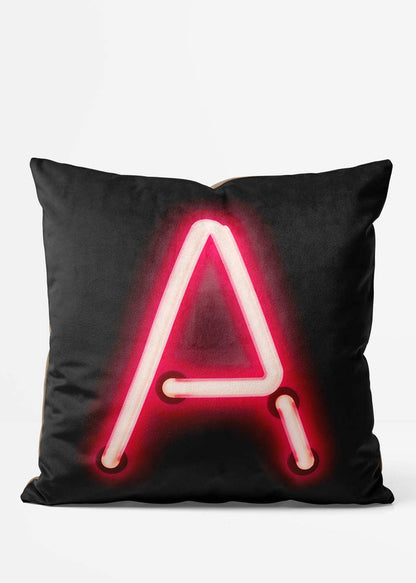 Custom Single Large Neon Letter Black Cushion, front view in red