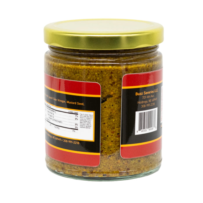 Jar of honey mustard with a gold lid on a white background