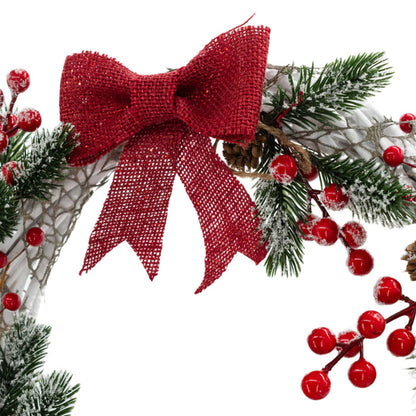 Red bow detail of a Christmas wreath made with white wires, green pine needles, red berries, and a red bow, crafted by KJ Made.
