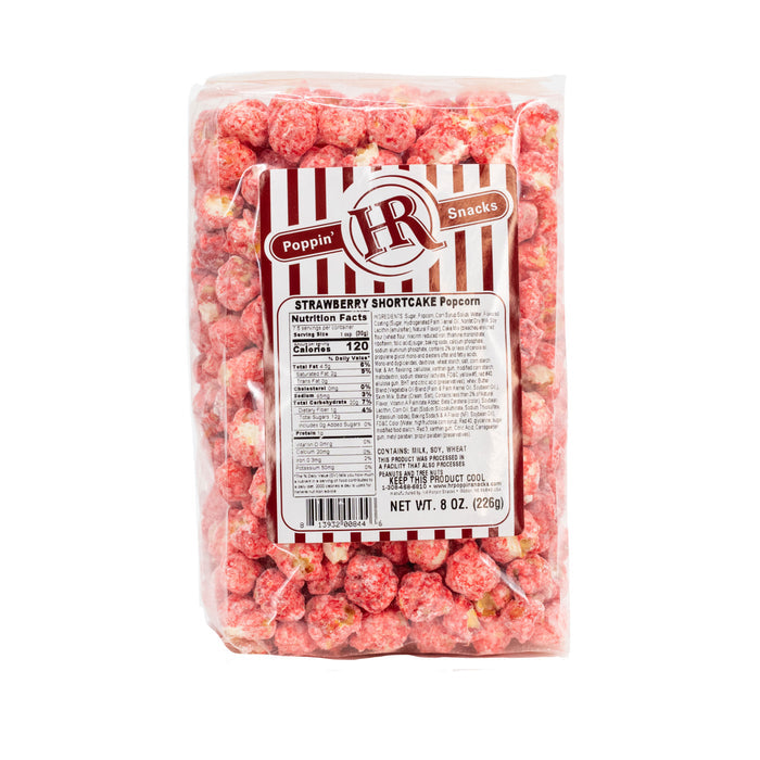 A pack of HR Poppin' Snacks Strawberry Shortcake flavored popcorn in an 8 oz bag.