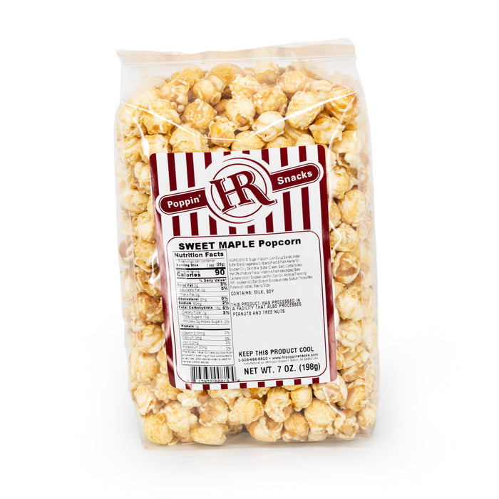 A pack of HR Poppin' Snacks Sweet Maple Popcorn in a clear plastic packaging showing the popcorn inside.