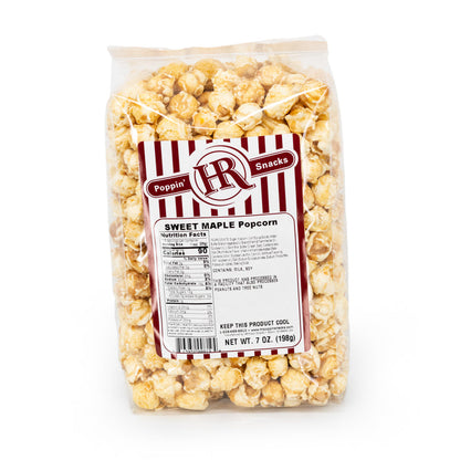 A pack of HR Poppin' Snacks Sweet Maple Popcorn in a clear plastic packaging showing the popcorn inside.