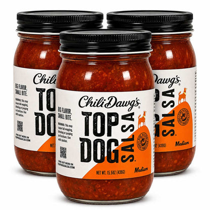 Three glass jars of Chili Dawg's Top Dog Salsa arranged in a studio shot on a white background, with the center jar in front and the side jars slightly behind it.